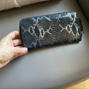 Leather Kenneth Cole snake print zipper wallet.